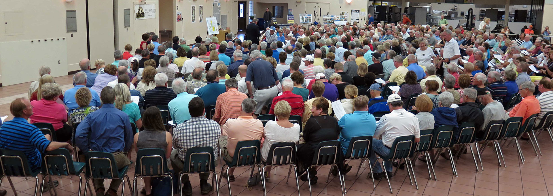 Large room full of people at a town hall