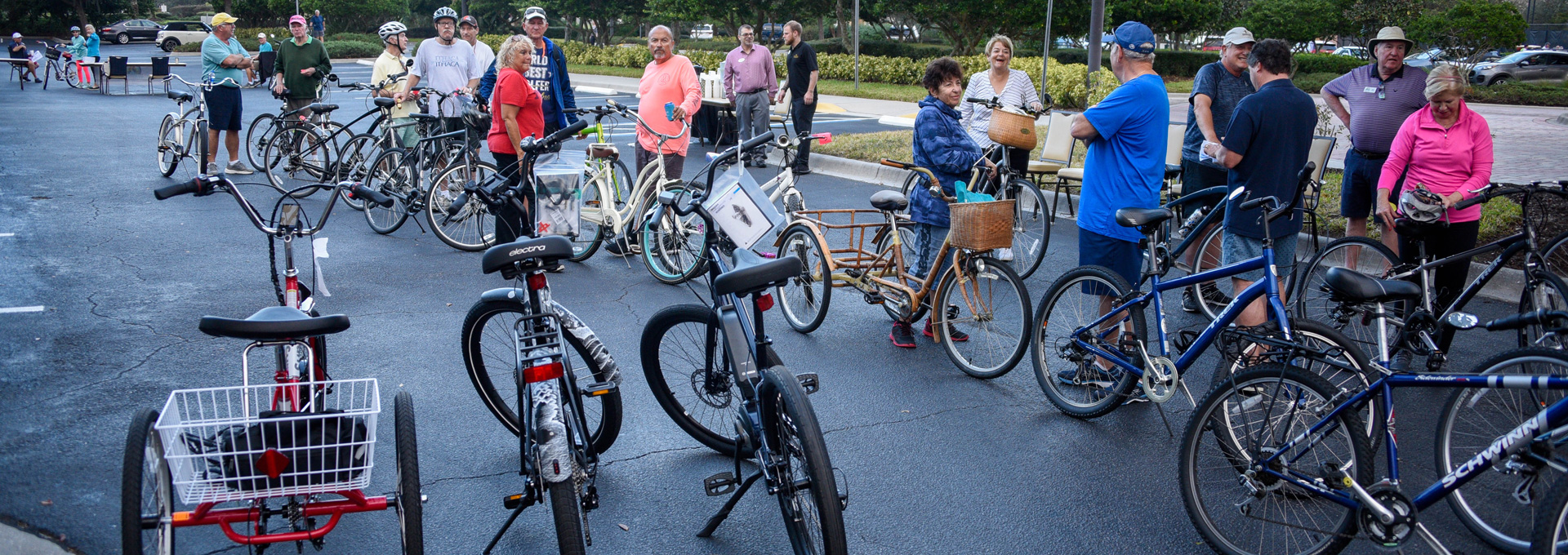 A group of people stand with bicycles